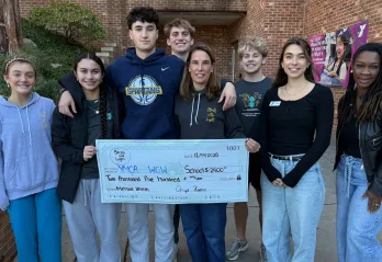 Stroll into Light presenting check to WGW