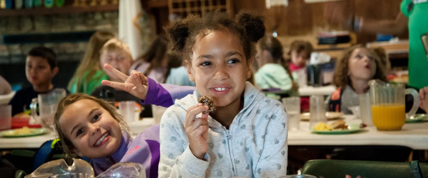 Girls eating cookies at Camp Hanes winter camp