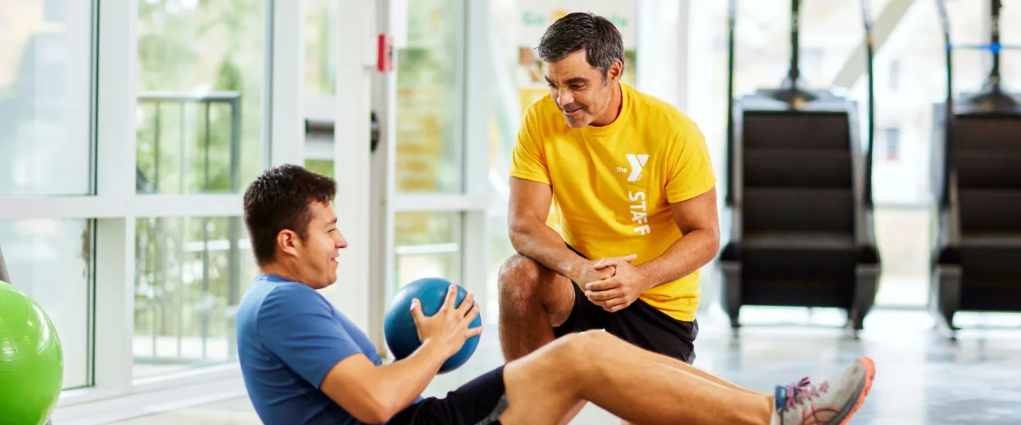 Man working out with trainer