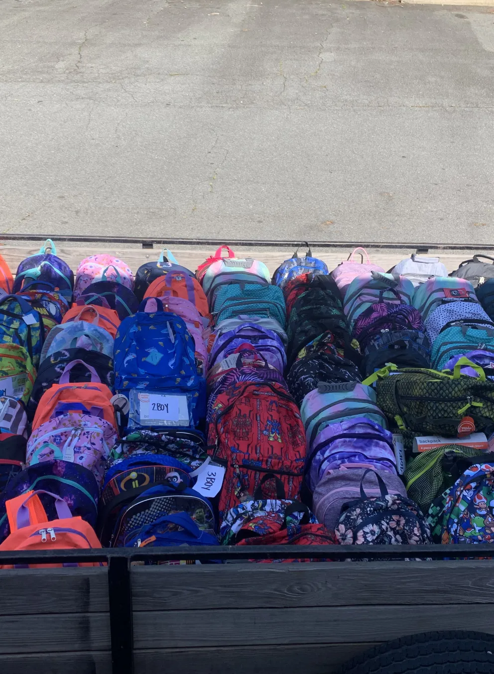A truck bed full of backpacks