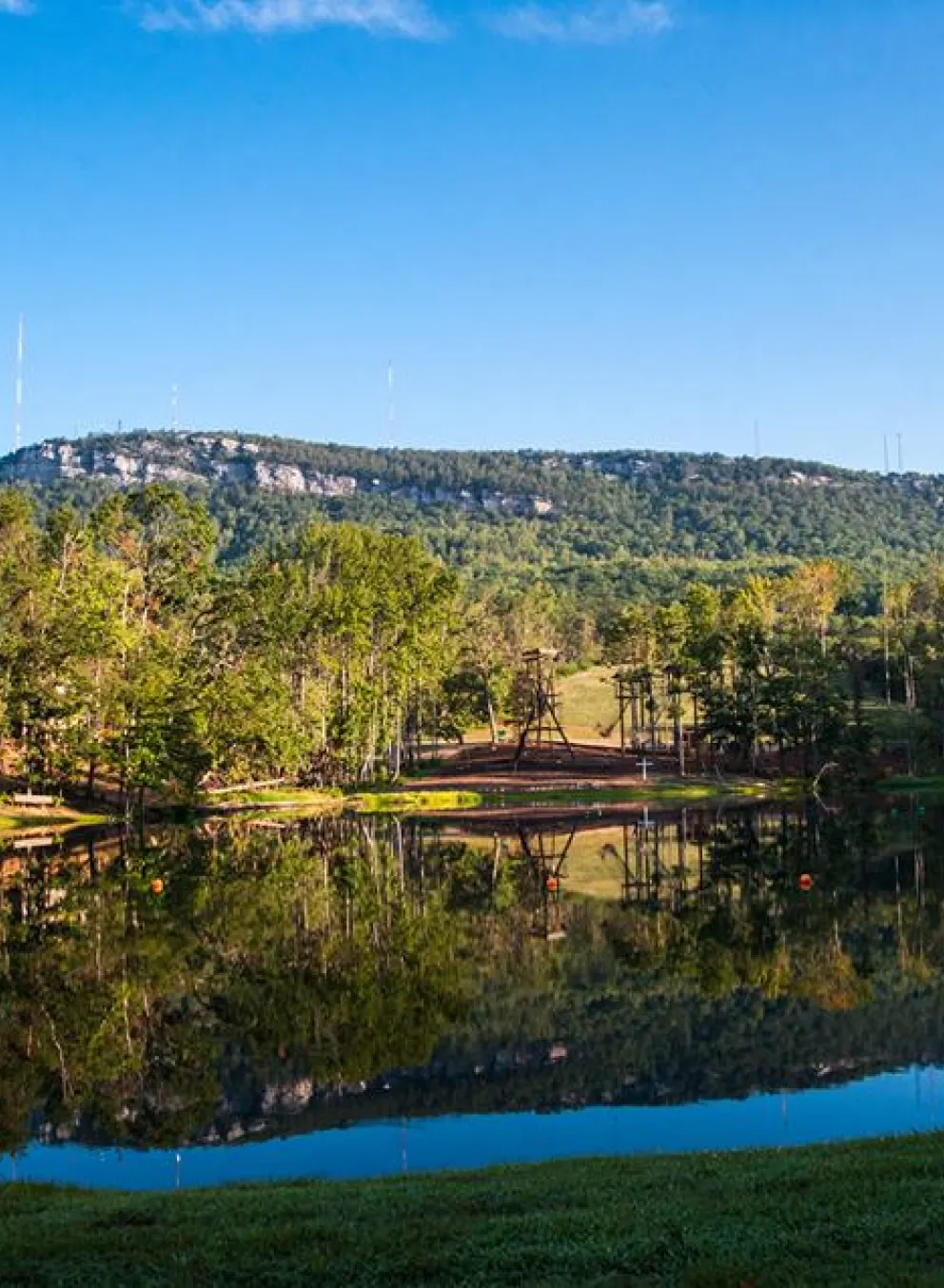 Looking across a reflective lake at Sauratown Mountain
