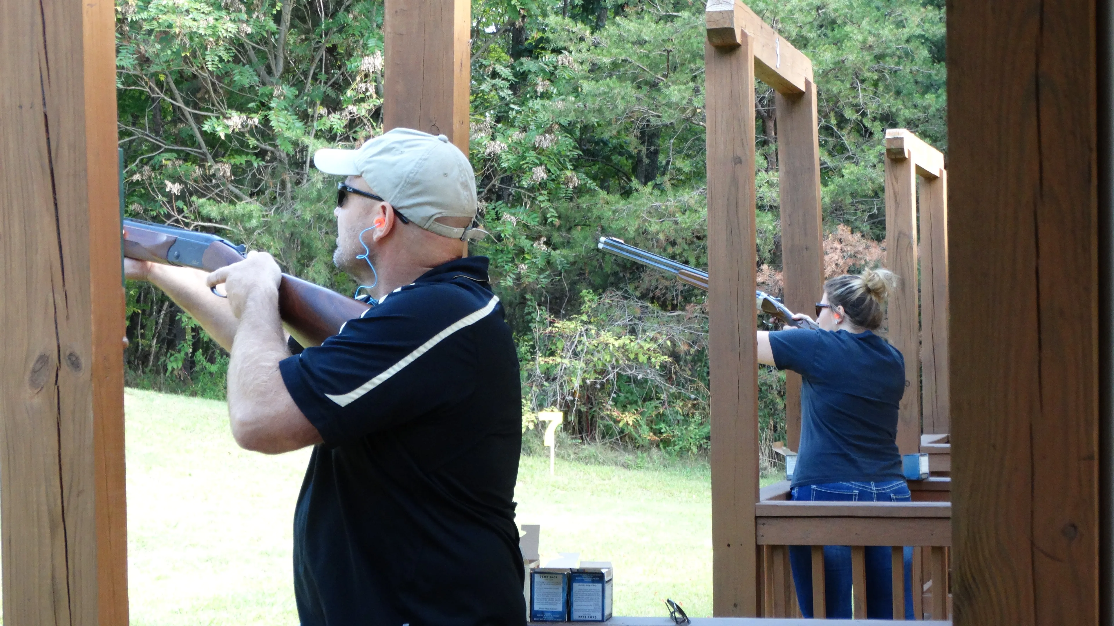 Adults shooting clays