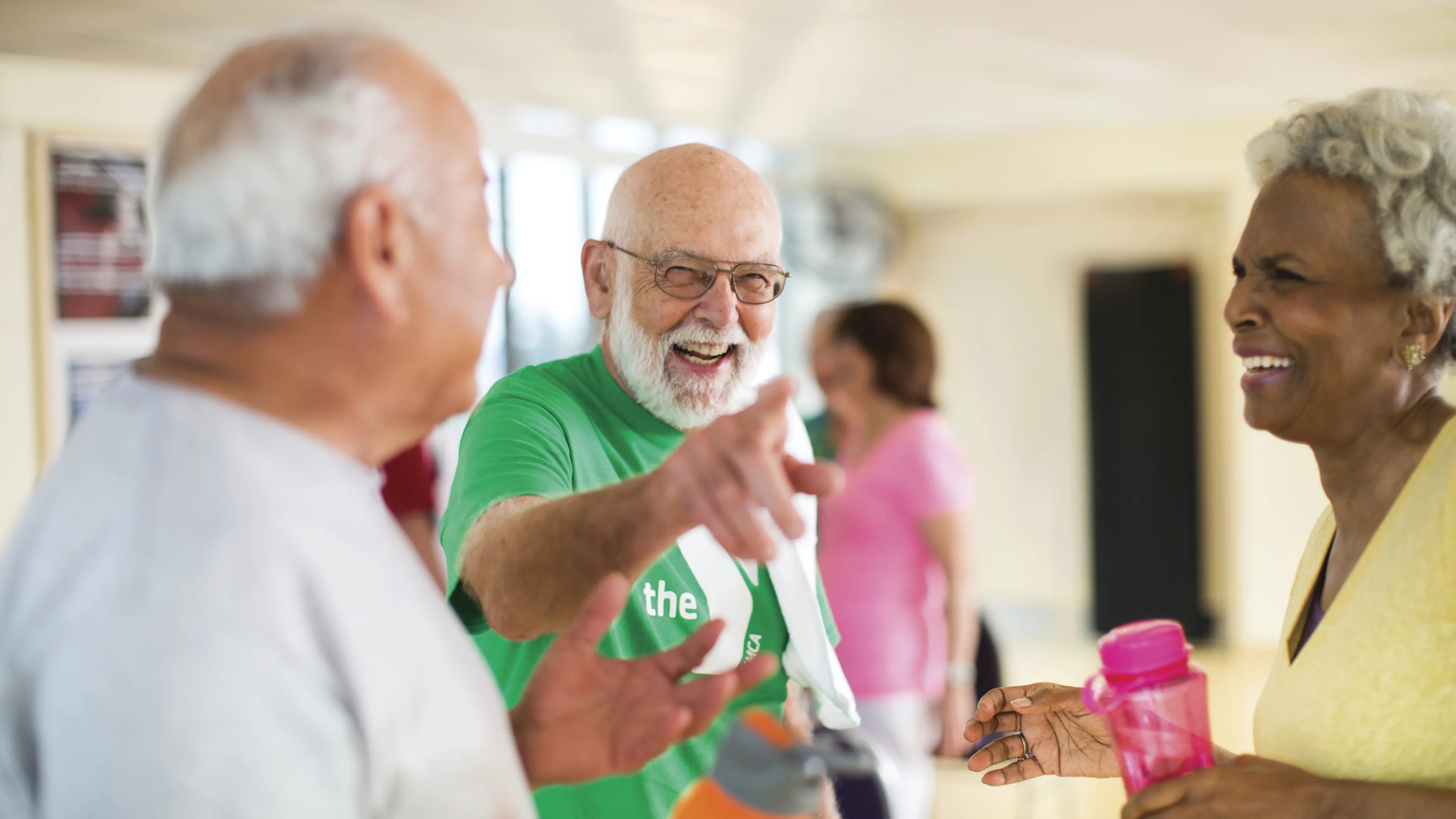 Three older adults smiling