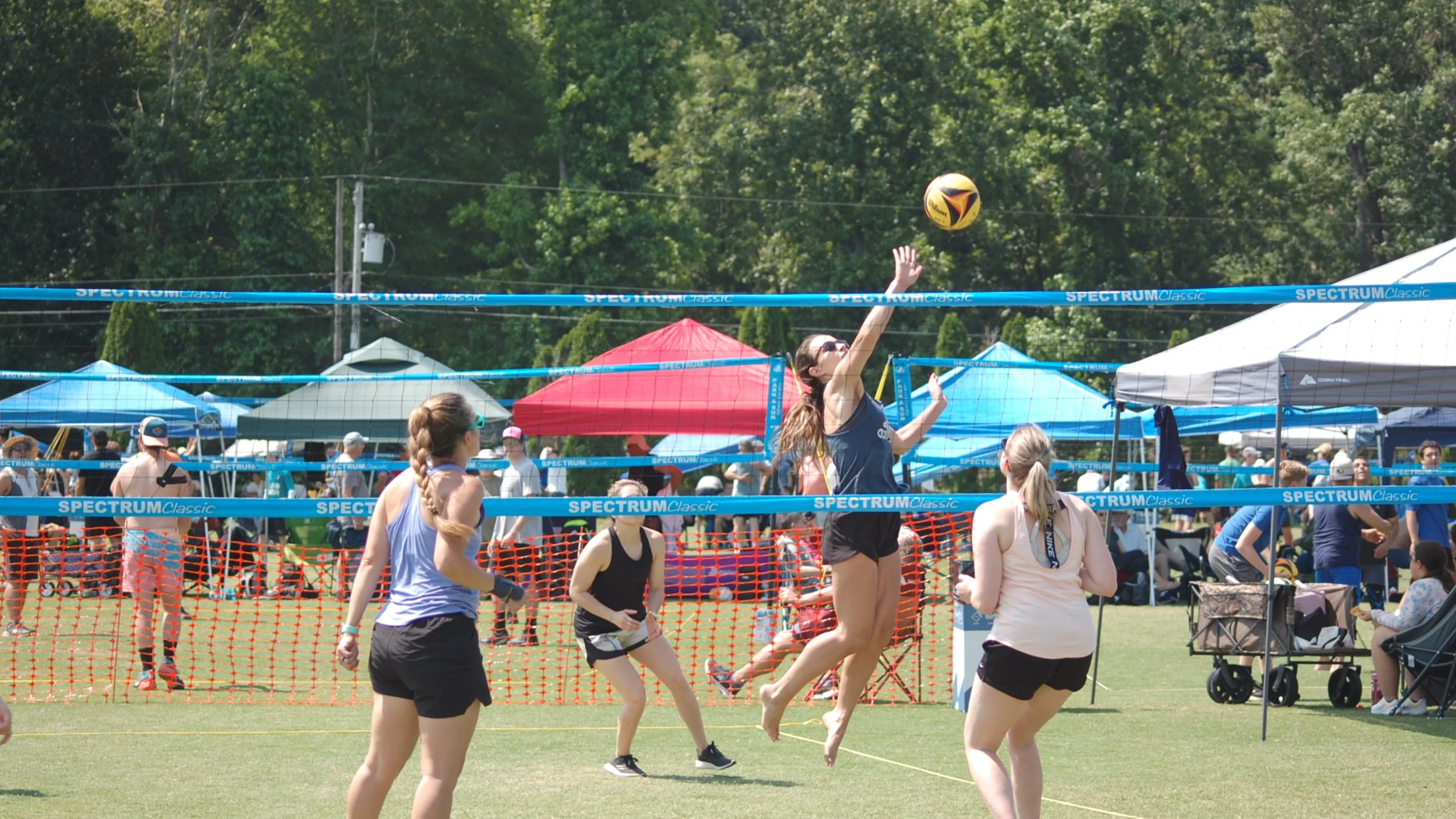 Women playing volleyball
