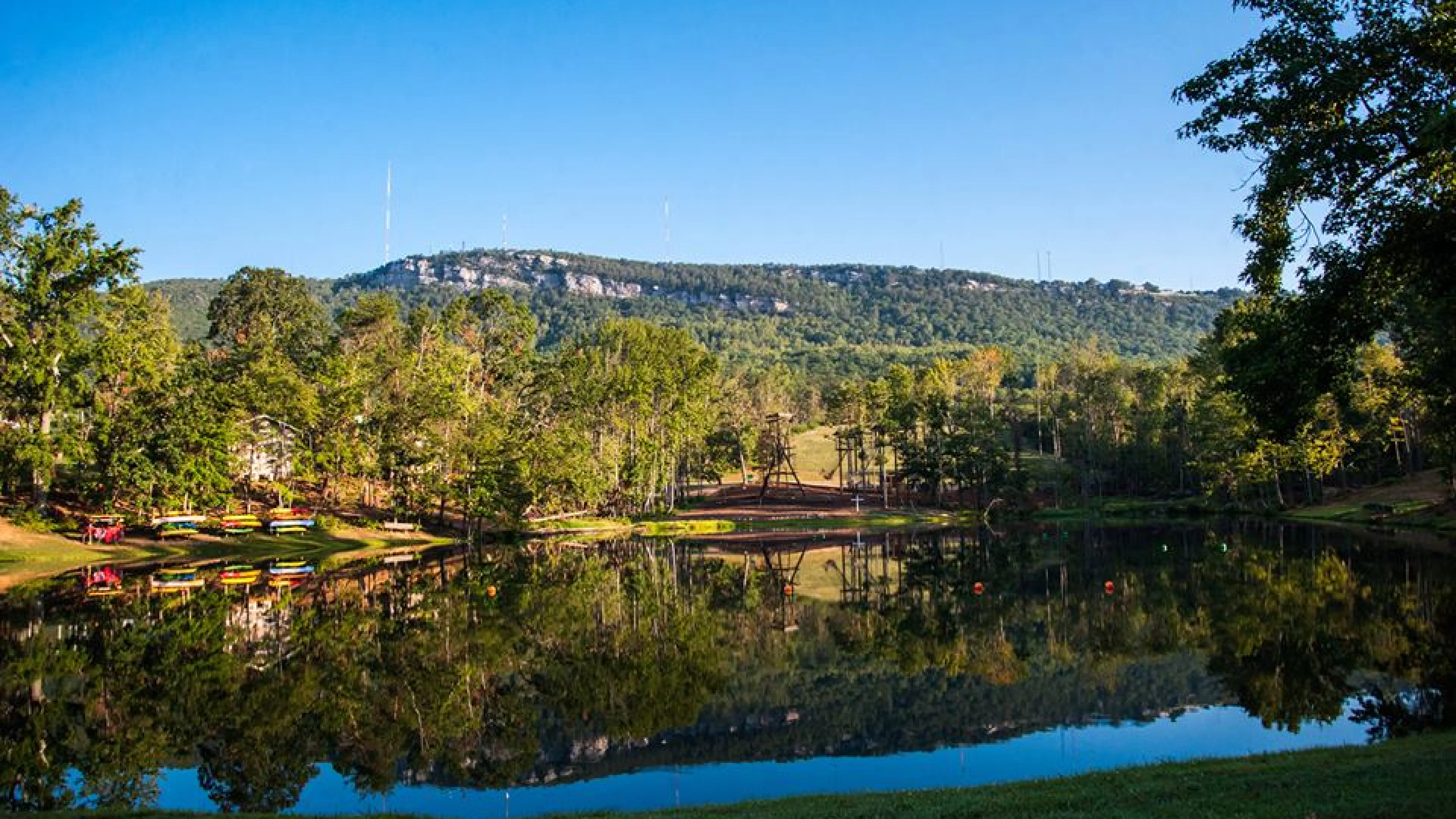Looking across a reflective lake at Sauratown Mountain