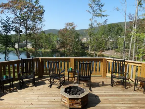 View off of our Alphin Retreat looking over the wooden deck at the upper lake. 