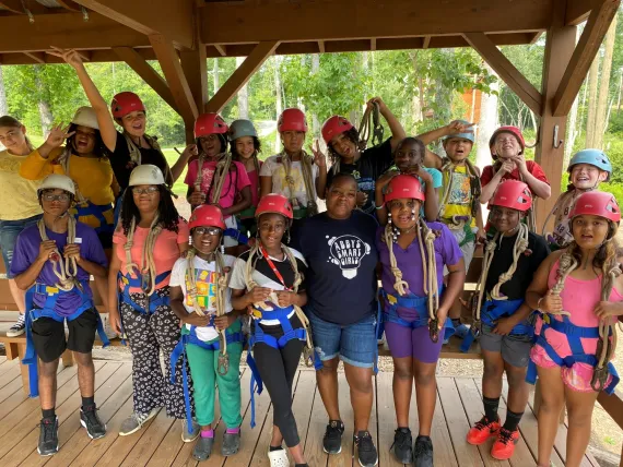 Group of kids with safety harnesses