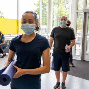 People entering the Y wearing masks