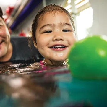 Girl taking a swim lesson