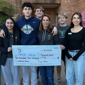 Stroll into Light presenting check to WGW