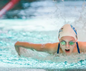 Person swimming butterly