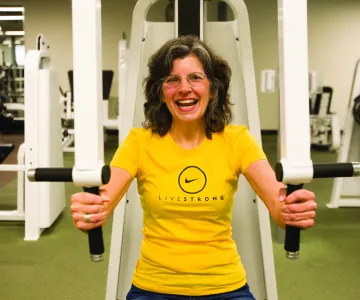 Woman working out with LIVESTRONG shirt
