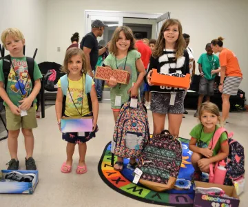 Kids with new shoes and backpacks