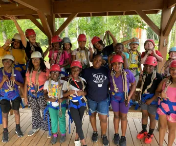 Group of kids with safety harnesses
