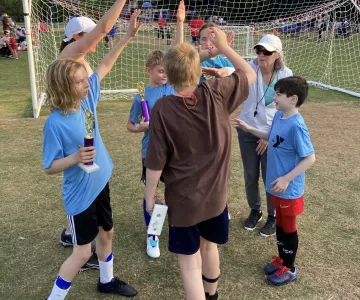 High fiving soccer players