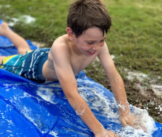 Boy on slip n slide