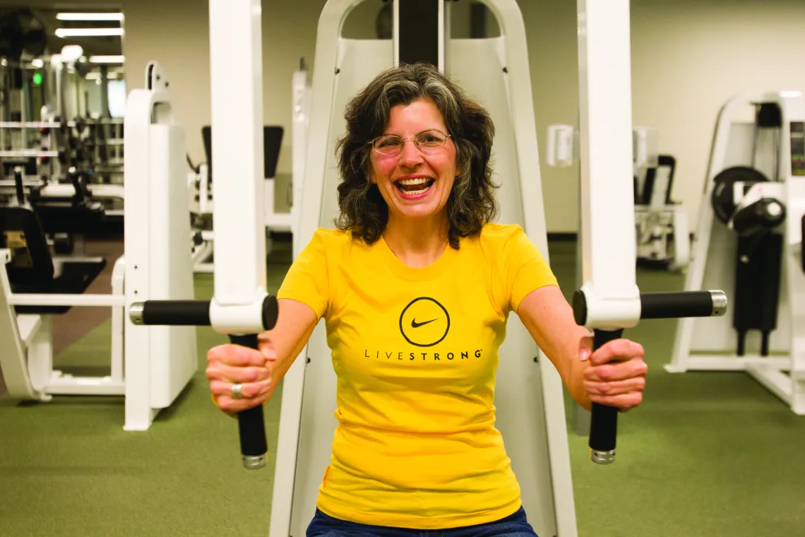 Woman working out with LIVESTRONG shirt