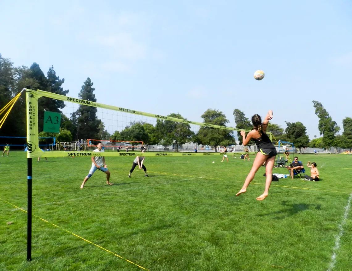 People playing volleyball outside