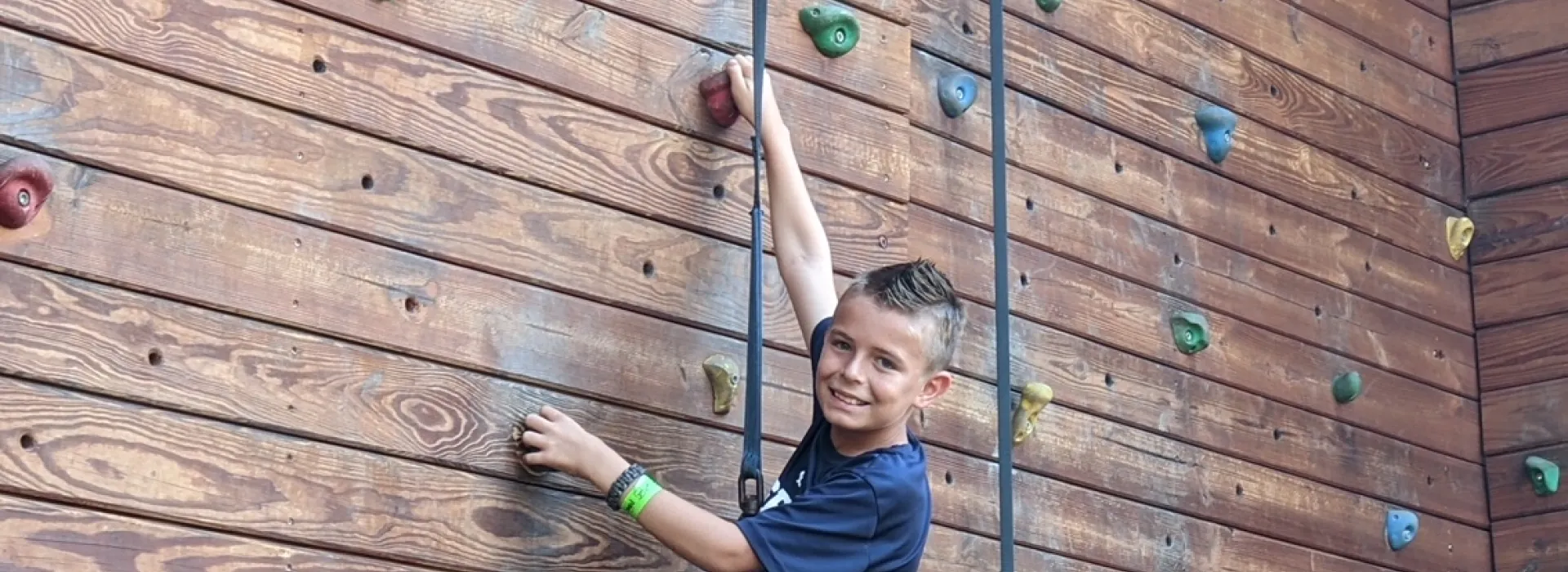 Boy on climbing wall